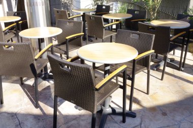 Empty chairs and tables before the opening of the cafeteria restaurant