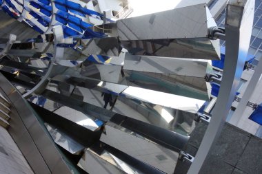 Exotic modern architecture abstract background structure made of metal with reflections