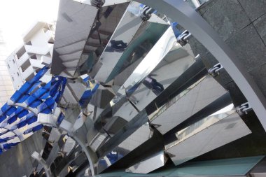 Exotic modern architecture abstract background structure made of metal with reflections