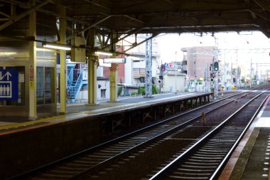 Tokyo, Japan - August 4th, 2018: Tokyo, city train station, tranquil scenery seen from the platform