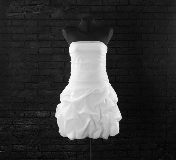 short white wedding dress on a mannequin