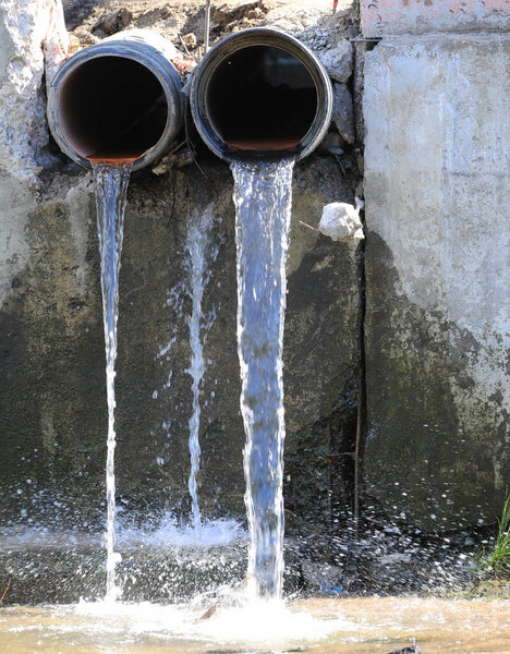 dirty water flows from two pipes
