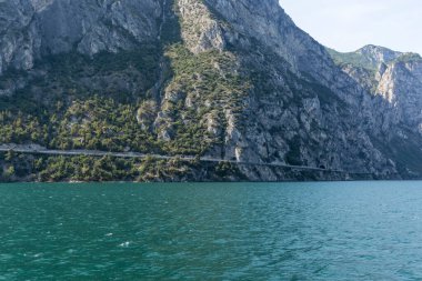 View from Lake Garda in Italy of the course of the Gardesana Occidentale road through the rock face on the western shore of the lake