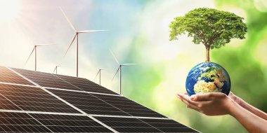 Güneş pili ve türbiniyle dünya üzerinde büyüyen el ele tutuşan ağaç. Dünyayı kurtarmak için temiz enerji kavramı. Bu görüntünün elementleri NASA 'ya döşendi