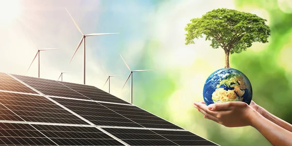 Güneş pili ve türbiniyle dünya üzerinde büyüyen el ele tutuşan ağaç. Dünyayı kurtarmak için temiz enerji kavramı. Bu görüntünün elementleri NASA 'ya döşendi