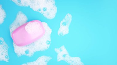 Pink soap bar with white foam on blue background. Higien or cleaning concept. 3D render image.