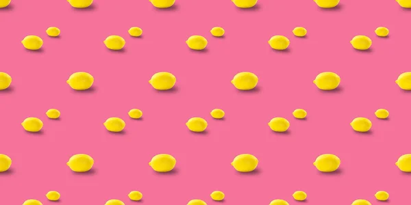 Juicy ripe flying yellow lemons on pink background. creative food concept. — Stock Photo, Image