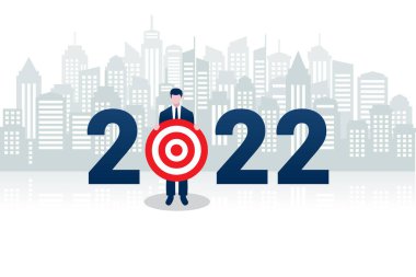 2022 yılı için hedef alan bir iş adamının resmi. Arka planda şehir manzaralı..