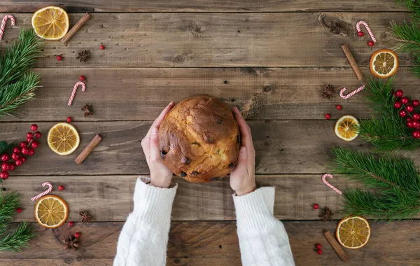 Women Hands Serving Panettone Wooden Base Christmas Decorations Copy Space — Stock Photo, Image