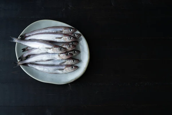 Fresh Blue Whiting Plate Black Wooden Background Fresh Fish Copy — Stockfoto