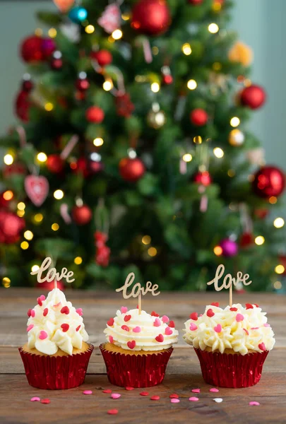 Three Cupcakes Decorated Wooden Background Love Sign Out Focus Christmas — Stock fotografie