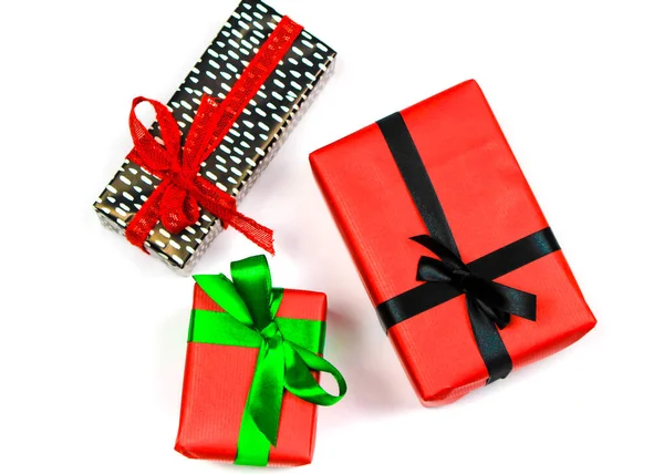 Gifts Wrapped Colorful Paper Red Green Black Bows White Background — Stock Photo, Image