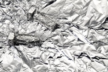 Folyo kağıdı ve vida şekli ile soyut arkaplan