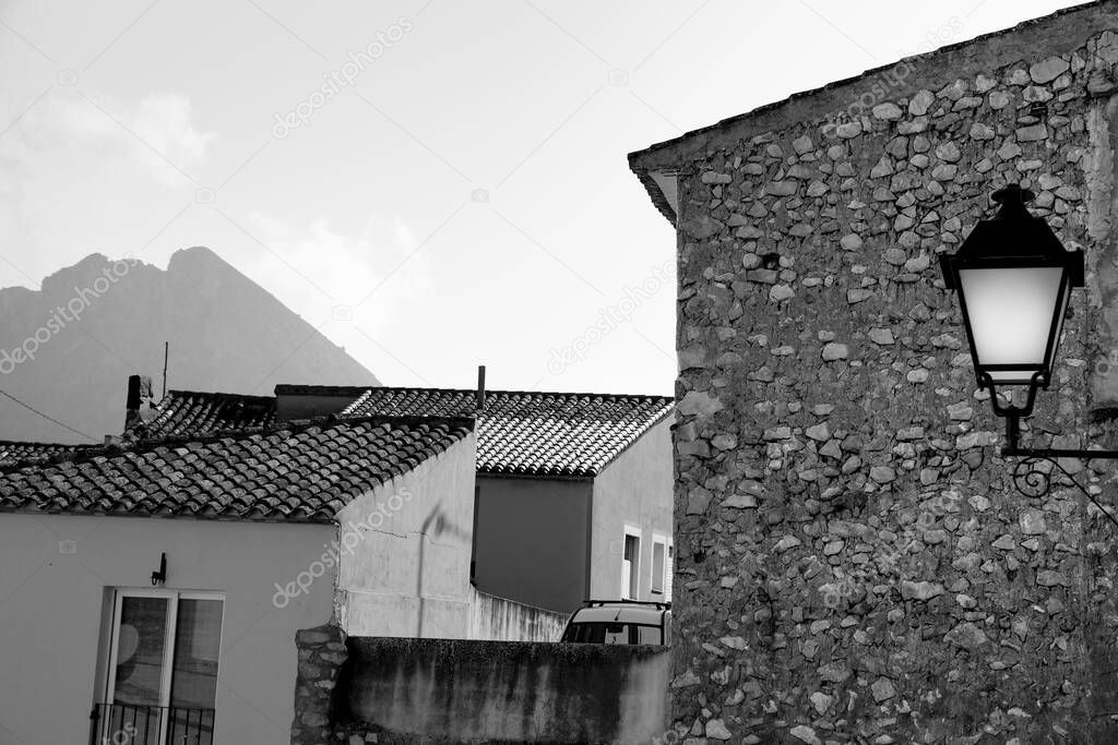 Narrow Street and typical facade of Bolulla village in Alicante, Spain