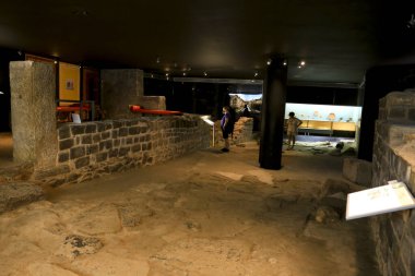 Cartagena, Murcia, Spain- July 25, 2019: Tourists visiting Archeological remains in the underground roman museum called Fortune House in Cartagena, Spain
