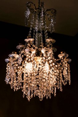 Cartagena, Murcia, Spain- July 17, 2022: Crystal Chandelier lamp hanging in Aguirre Palace in Cartagena city