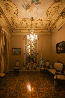 Cartagena, Murcia, Spain- July 17, 2022: Vintage and antique room with beautiful door and furniture of Aguirre Palace in Cartagena city