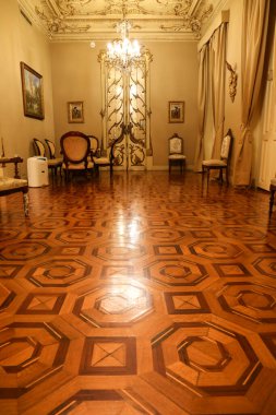 Cartagena, Murcia, Spain- July 17, 2022: Vintage and antique room with beautiful door and furniture of Aguirre Palace in Cartagena city
