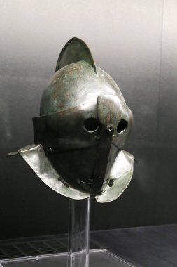 Alicante, Spain- July 20, 2022: Helmet of a Secutor Gladiator of the temporal exhibition at the Archaeological Museum of Alicante