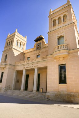 Alicante, Spain- July 20, 2022: Main entrance and facade of the Archaeological Museum of Alicante in Summer.