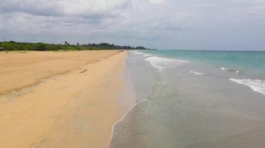 Aerial view of Tropical sandy beach and blue sea. Sri Lanka. Summer and travel vacation concept.