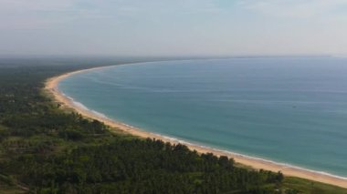 Aerial view of Tropical sandy beach and blue sea. Kalkudah Beach, Sri Lanka.