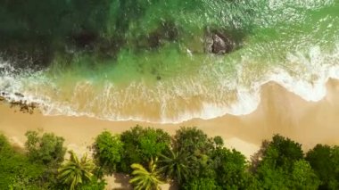 Aerial drone of Seascape with tropical sandy beach and blue ocean. Hiriketiya, Sri Lanka.
