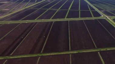 Agricultural land and farm fields prepared for planting crops. Countryside with farmland.