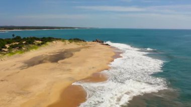 Aerial view of Wide sandy beach with ocean surf and waves. Whiskey point, Sri Lanka.