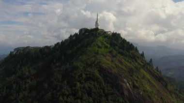 Ambuluwawa Tower is a temple of four religions in Sri Lanka. The tower rises above the jungle on a high mountain.