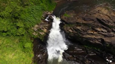 Waterfall in the tropical mountain jungle. St. Clair Falls, Sri Lanka.
