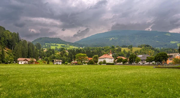 Austrian village Dellach im Drautal with the mountains in the background