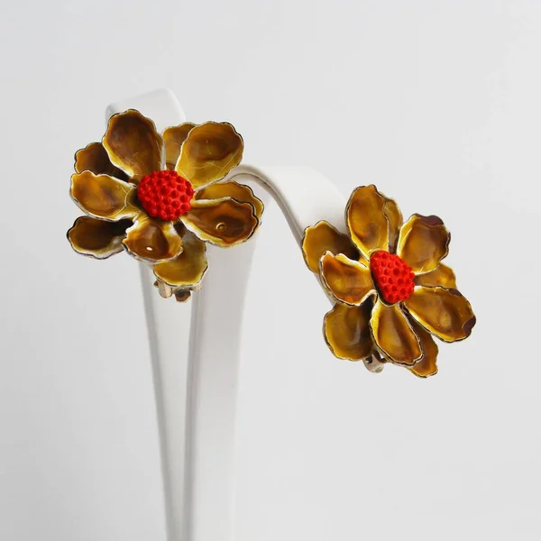 Vintage Ochre Sienna Enamel Flowers Clip Earrings Pattern Background — стоковое фото