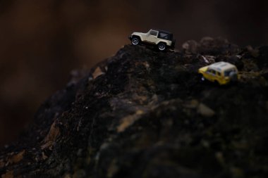 Group of 4wd off road cars crossing through the country road. Travel and racing concept for four wheel drive and off road  vehicle .