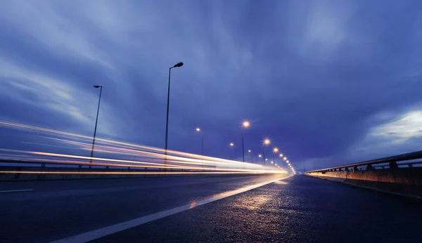 Long Exposure Traffic Light Trails Night Storm Clouds — стоковое фото