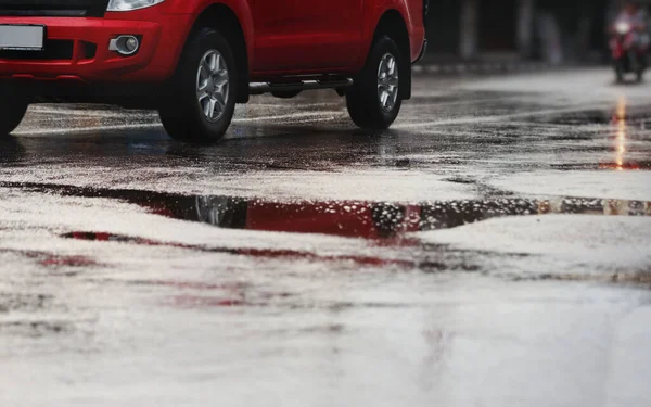 Car on the wet street after hard rain fall,selective focus.