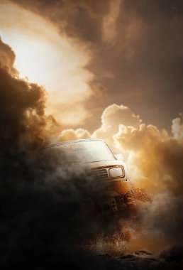 Çamurlu bir delikten çıkan arazi aracı kırmızı toprakla kaplı.,