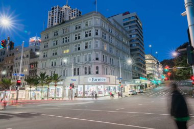 Auckland New Zealand - March 25 2018; Downtown city Queen and Victoria Streets intersection in long exposure at night looking across to Farmers department store.