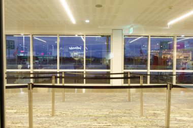 Gold Coast -Australia June 13 2022; Airport interior with queuing aisles empty under covid travel impacts and reflections in windows clipart