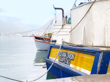 Capetown South Africa - August 24 2007; stern and bow of moored commercial fishing boats