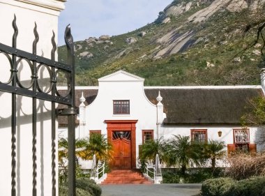 Stylish building facade in Cape Dutch architectural style in South Africa.