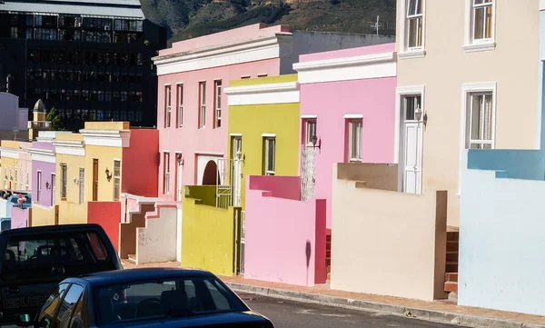 Street of distinctive pastel colored buildings in district of Bo-Kaap in Cape Town.