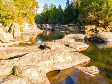 Stream and waterfall over rocks at McLaren Falls Park and Lake.