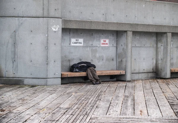 Poverty City Man Asleep Hiding Clothing Bench Signs Banning Smoking — Stock Photo, Image