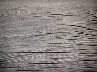 Old timber plank grainy and cracked by weather and time.