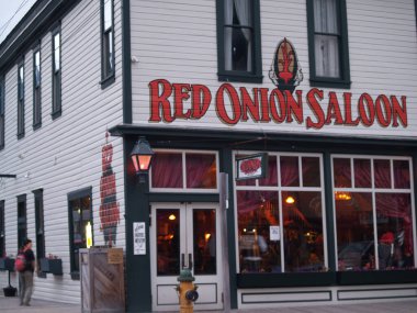 Skagway Alaska USA - August 2 2008;City street with old style building facades and sign for Red Onion Saloon