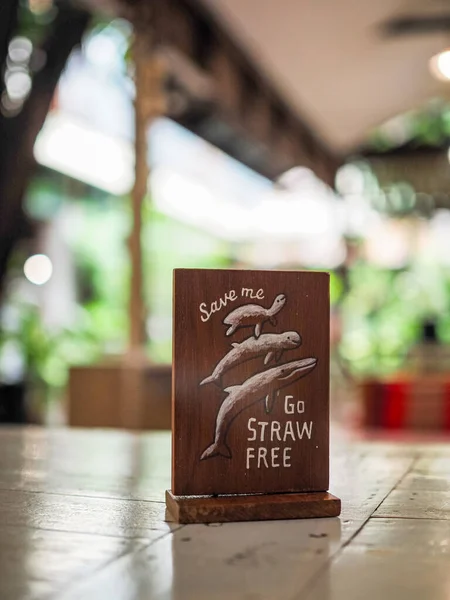 Go Straw Free banner on on restaurant table