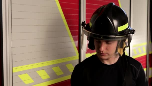 Cute Young Firefighter Helmet Raises His Hands Looks Confidently Camera — Vídeo de Stock