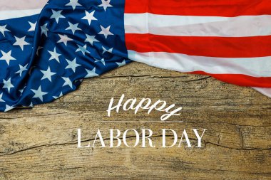 Labor Day Text Over Old Wood Wall Texture Background and American Flags