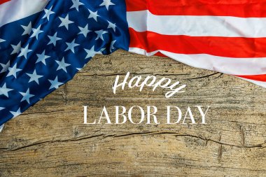 Labor Day Text Over Old Wood Wall Texture Background and American Flags